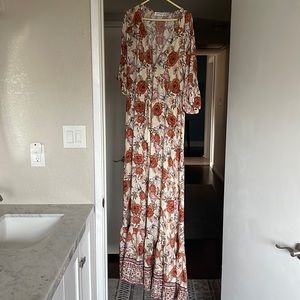 Never worn maxi dress made by Petal &Pup. Very pretty fabric size 12